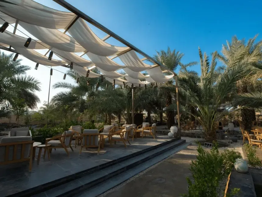 Outdoor café seating at Al Marbad Farm.