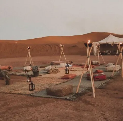 Open-air camp seating in a desert setting.