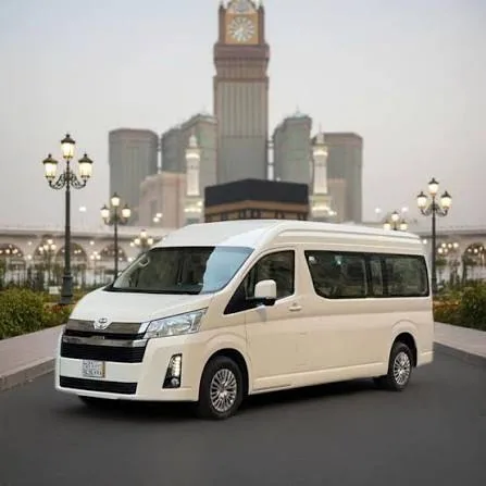 Passenger van in a city setting; vehicle type is illustrative.